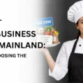 A female chef holding two plates displaying business options for Dubai food business freezone vs mainland.